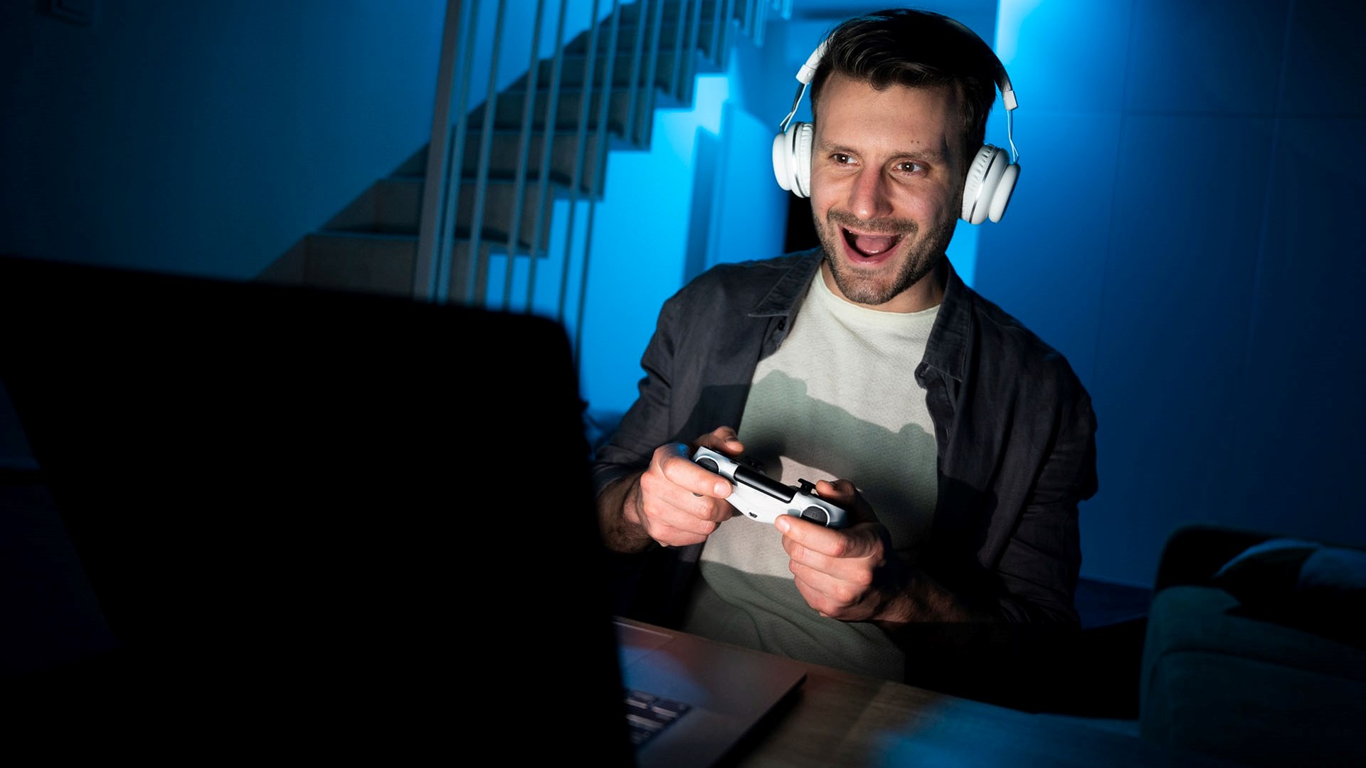 A person having fun playing in laptop